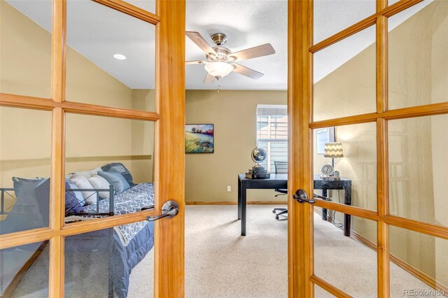 home office with french doors, carpet, ceiling fan, and baseboards