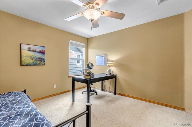 carpeted bedroom with baseboards and ceiling fan