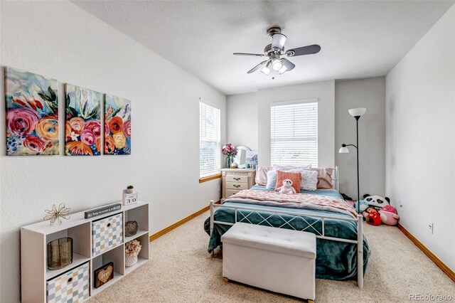 bedroom with baseboards, a ceiling fan, and carpet