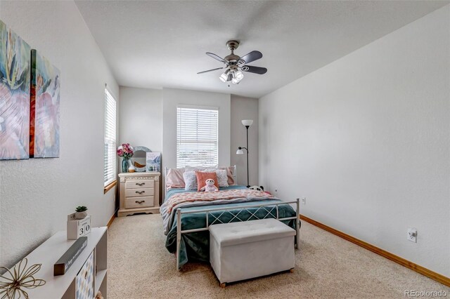 bedroom featuring baseboards, carpet, and a ceiling fan