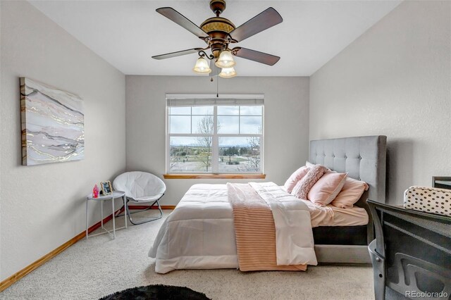 bedroom with baseboards, a ceiling fan, and carpet flooring