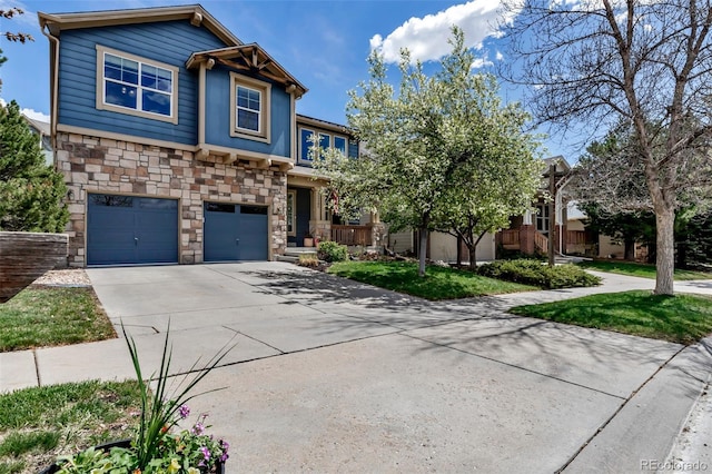 25245 E Park Crescent Dr, Aurora, CO 80016 - craftsman-style house featuring stone siding, concrete driveway, and a garage