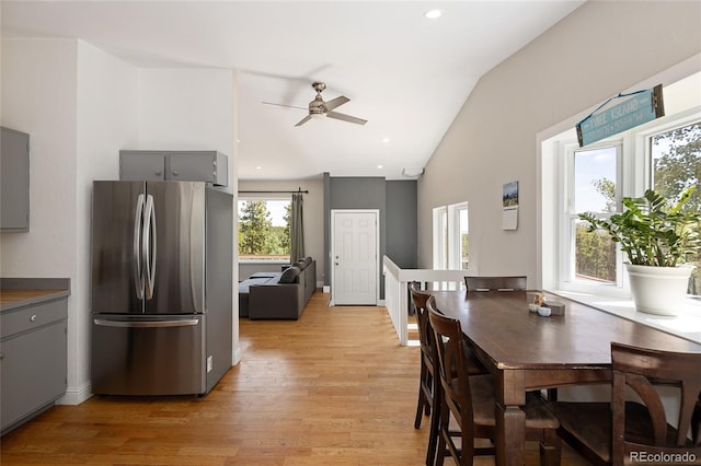 9123 Gray Ln, Conifer, CO 80433 - dining room with a ceiling fan, light wood-style flooring, and high vaulted ceiling