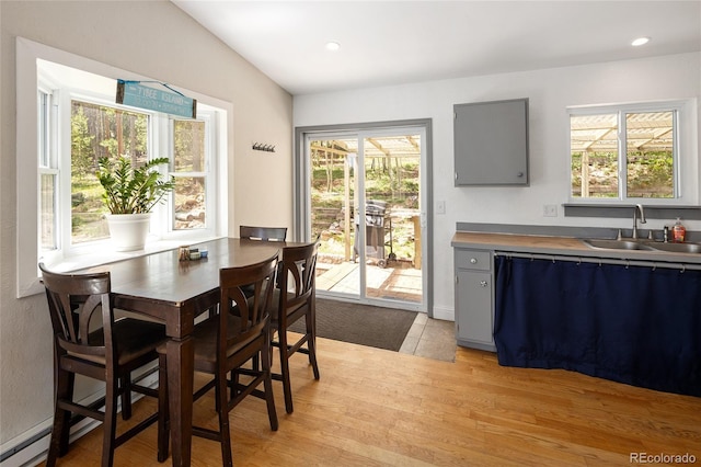 9123 Gray Ln, Conifer, CO 80433 - dining space featuring light wood-style floors, plenty of natural light, and recessed lighting