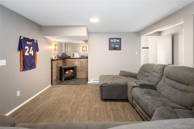 9123 Gray Ln, Conifer, CO 80433 - living room featuring wood finished floors, a baseboard heating unit, recessed lighting, and a fireplace