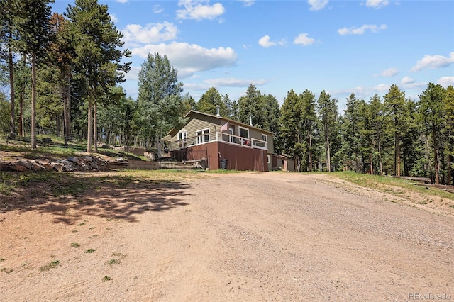 9123 Gray Ln, Conifer, CO 80433 - view of front facade featuring a view of trees