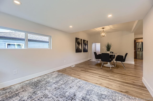 1640 Iola St, Aurora, CO 80010 - dining space featuring a chandelier, light wood-style floors, and recessed lighting