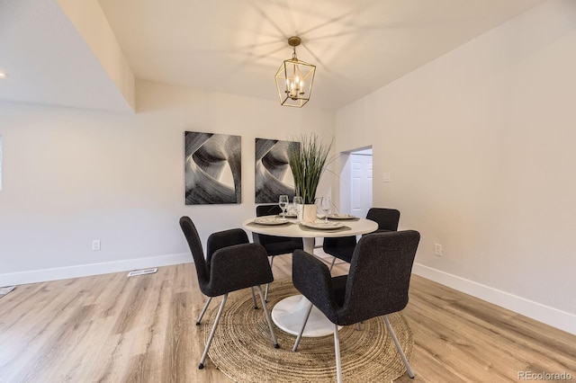 1640 Iola St, Aurora, CO 80010 - dining area with light wood-type flooring and a chandelier