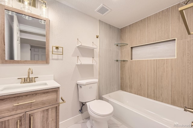 1640 Iola St, Aurora, CO 80010 - bathroom featuring vanity, marble look tiles, and shower / washtub combination
