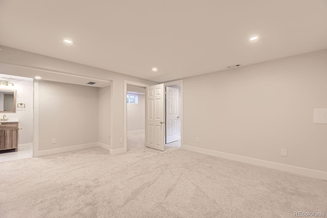 1640 Iola St, Aurora, CO 80010 - finished basement with light colored carpet and recessed lighting