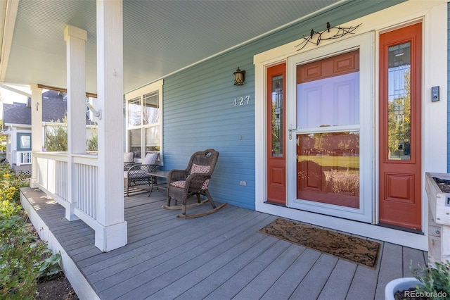 doorway to property with covered porch