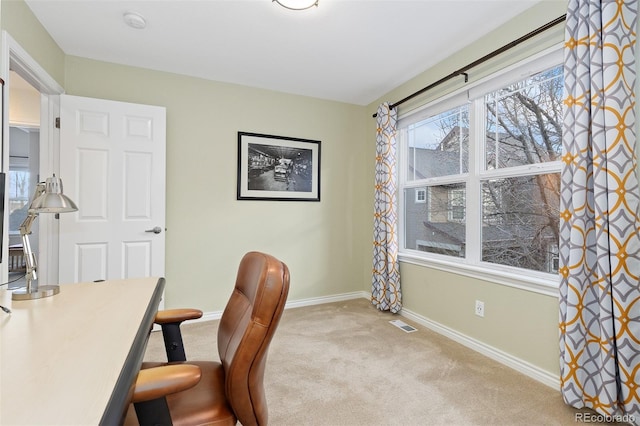 carpeted office with baseboards