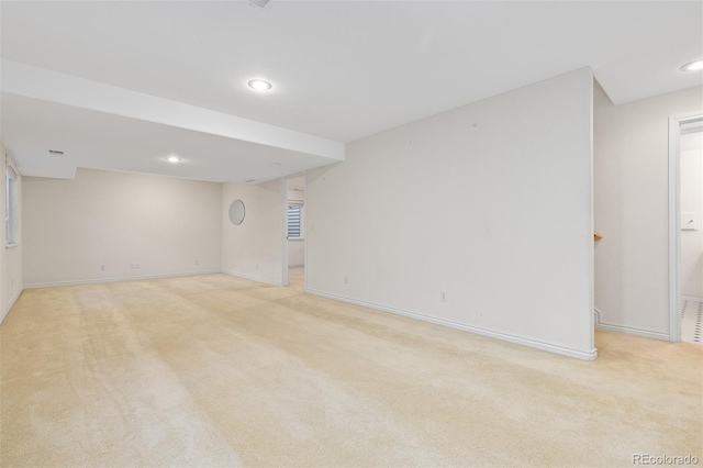 unfurnished room with light carpet, baseboards, and recessed lighting