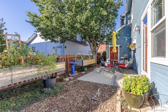 view of yard featuring a patio area and fence