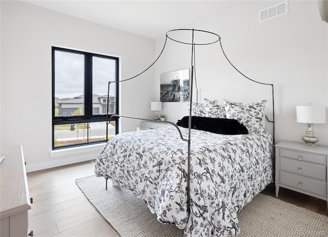 bedroom with light hardwood / wood-style floors