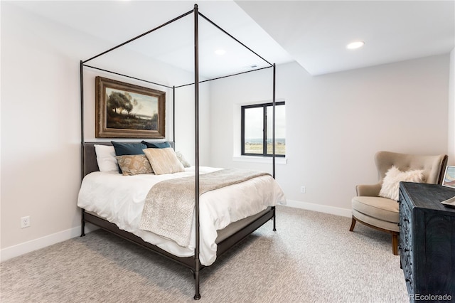 bedroom with light colored carpet