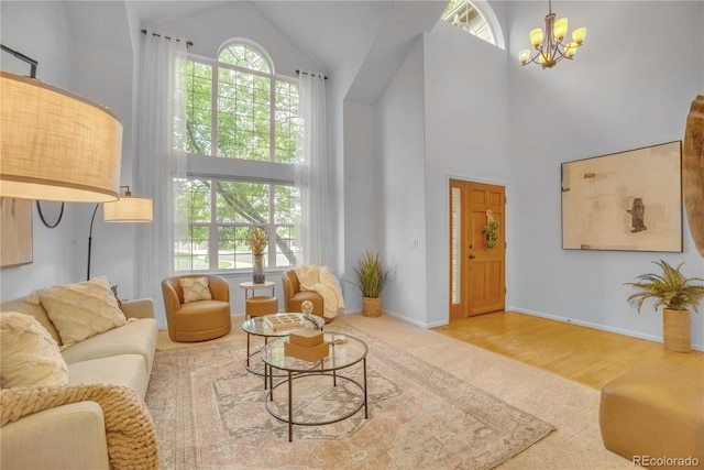 10356 Lions Heart, Lone Tree, CO 80124 - living room with high vaulted ceiling, carpet floors, and a chandelier