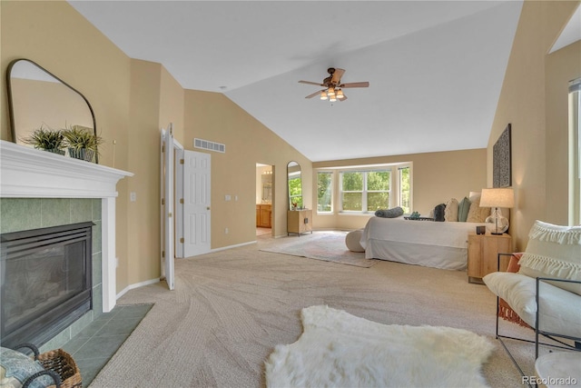 10356 Lions Heart, Lone Tree, CO 80124 - bedroom featuring carpet, high vaulted ceiling, a tiled fireplace, and a ceiling fan