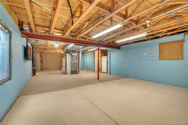 10356 Lions Heart, Lone Tree, CO 80124 - unfinished basement featuring heating unit and freestanding refrigerator
