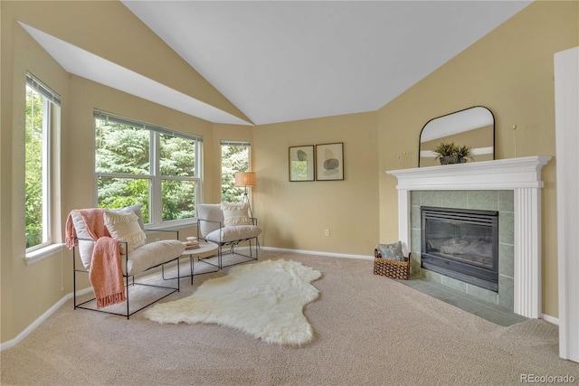 10356 Lions Heart, Lone Tree, CO 80124 - carpeted living room with a tiled fireplace and lofted ceiling