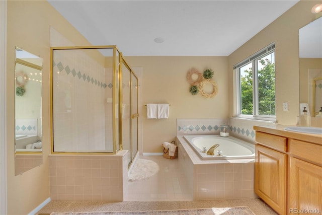 10356 Lions Heart, Lone Tree, CO 80124 - full bath with vanity, a garden tub, a stall shower, and tile patterned floors