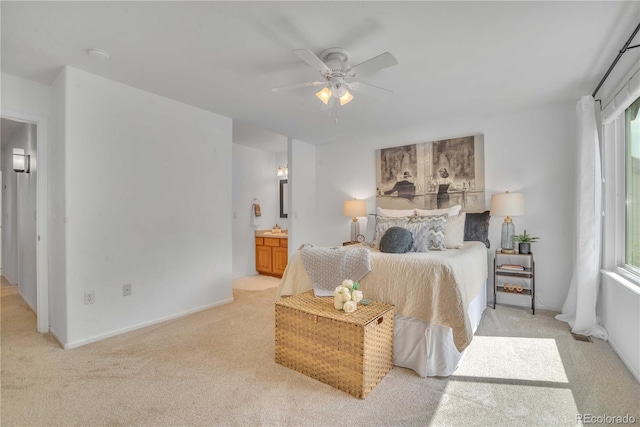 10356 Lions Heart, Lone Tree, CO 80124 - bedroom with light carpet, multiple windows, ensuite bathroom, and ceiling fan