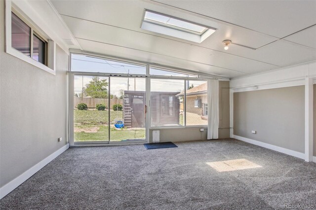 10505 Clarkson St, Northglenn, CO 80233 - carpeted spare room with lofted ceiling, baseboards, and a skylight