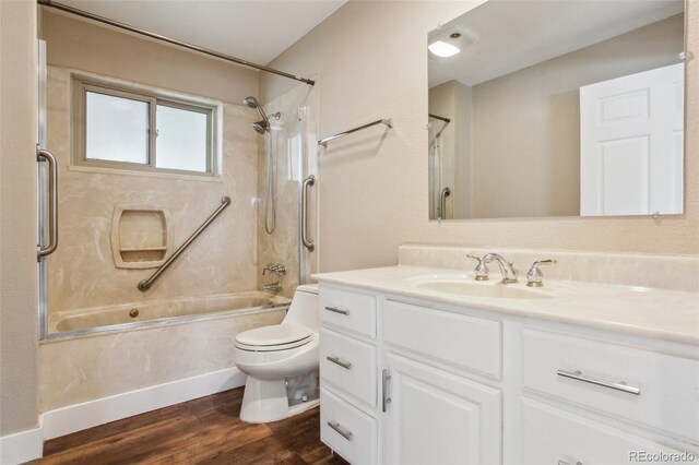 10505 Clarkson St, Northglenn, CO 80233 - bathroom featuring toilet, shower / washtub combination, vanity, and wood finished floors