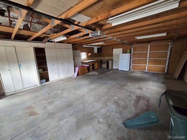 10505 Clarkson St, Northglenn, CO 80233 - garage with freestanding refrigerator and a garage door opener