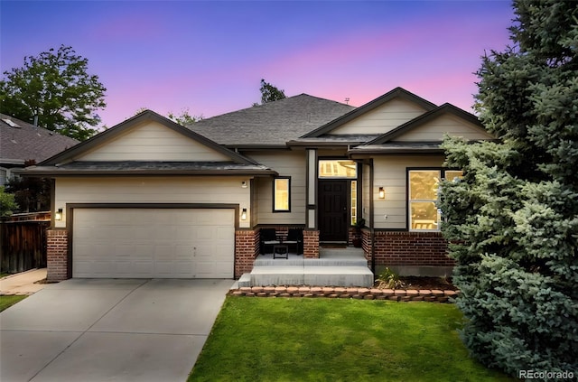 10553 Stonemeadow Dr, Parker, CO 80134 - view of front facade with brick siding, driveway, a garage, a lawn, and roof with shingles