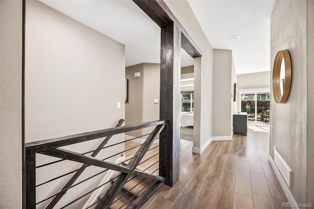 10553 Stonemeadow Dr, Parker, CO 80134 - hallway with an upstairs landing and wood finished floors