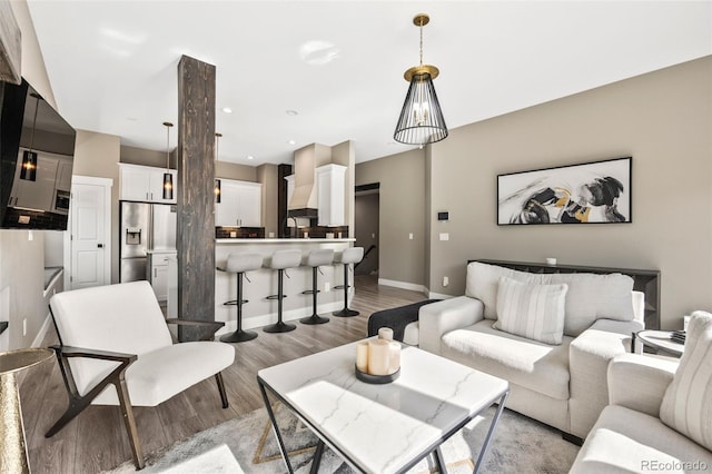 10553 Stonemeadow Dr, Parker, CO 80134 - living room featuring light wood finished floors and recessed lighting