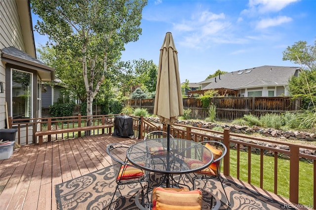 10553 Stonemeadow Dr, Parker, CO 80134 - wooden terrace with a fenced backyard, outdoor dining space, and area for grilling
