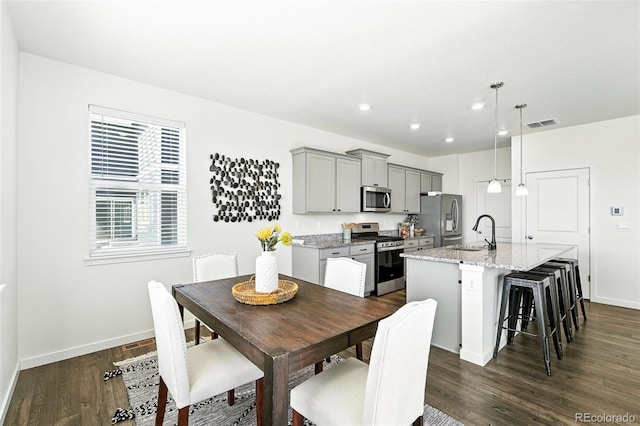 226 Racer St, Bennett, CO 80102 - dining area featuring dark wood-style floors and recessed lighting