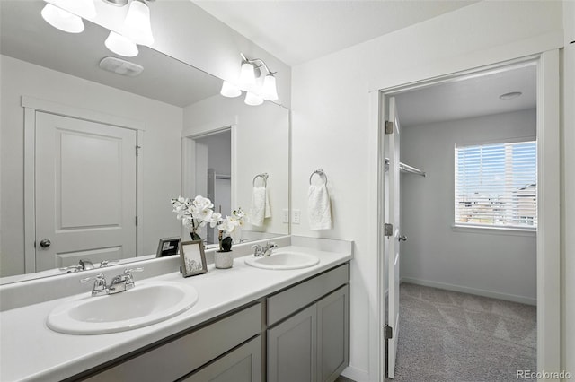 226 Racer St, Bennett, CO 80102 - full bathroom with double vanity and baseboards