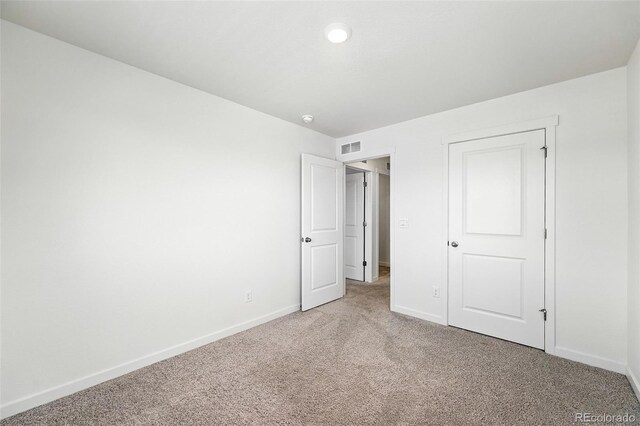 226 Racer St, Bennett, CO 80102 - unfurnished bedroom with light carpet and baseboards