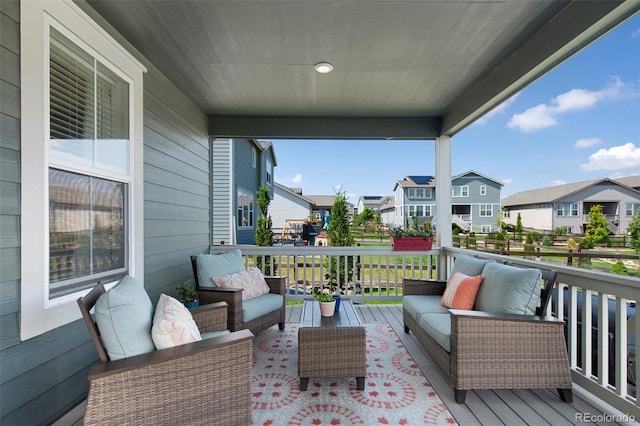 12826 Lake Port St, Longmont, CO 80504 - wooden deck featuring outdoor lounge area and a residential view