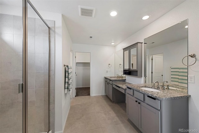 12826 Lake Port St, Longmont, CO 80504 - full bathroom featuring a stall shower, vanity, a walk in closet, recessed lighting, and tile patterned floors