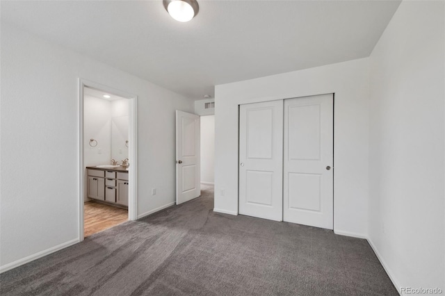 12826 Lake Port St, Longmont, CO 80504 - unfurnished bedroom featuring carpet floors, a closet, and connected bathroom