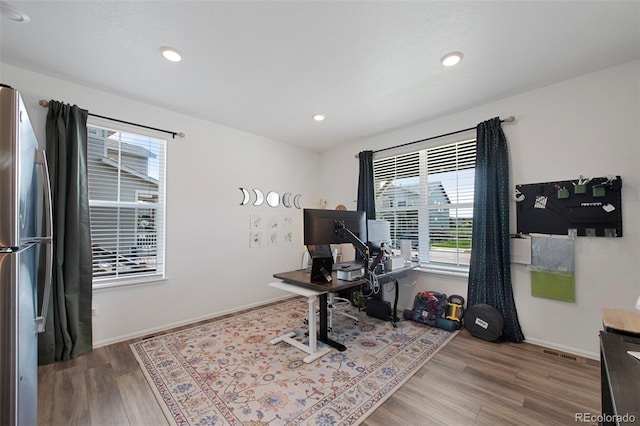 12826 Lake Port St, Longmont, CO 80504 - office space featuring wood finished floors and recessed lighting