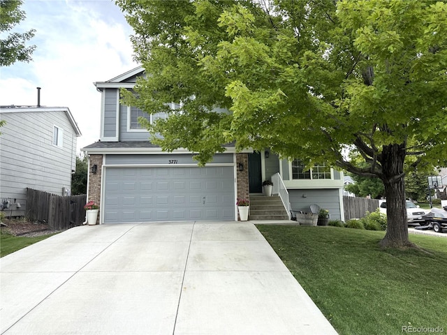 3771 S Kirk Way, Aurora, CO 80013 - obstructed view of property with brick siding, concrete driveway, and a garage