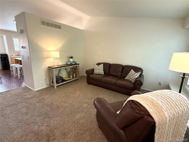 3771 S Kirk Way, Aurora, CO 80013 - living room featuring carpet floors and vaulted ceiling
