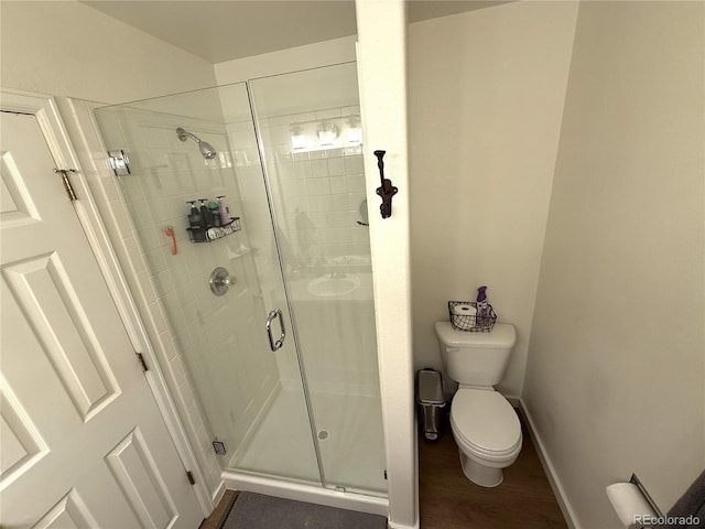 3771 S Kirk Way, Aurora, CO 80013 - full bath featuring a shower stall and wood finished floors
