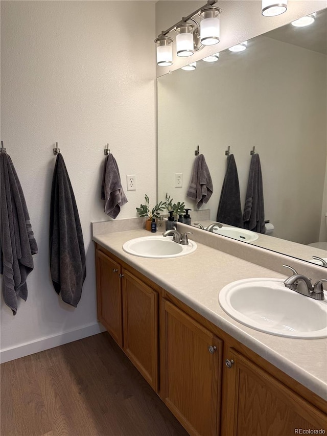 3771 S Kirk Way, Aurora, CO 80013 - bathroom with double vanity and wood finished floors