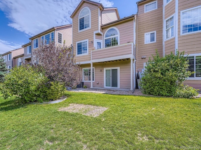 6827 S Webster St Unit E, Littleton, CO 80128 - back of house with a lawn