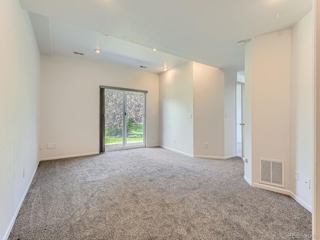 6827 S Webster St Unit E, Littleton, CO 80128 - carpeted empty room featuring baseboards and a smoke detector