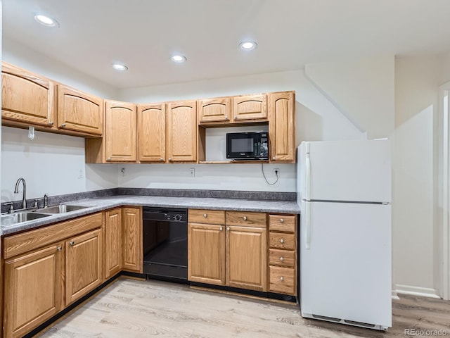 6827 S Webster St Unit E, Littleton, CO 80128 - kitchen with black appliances, light wood-style flooring, dark countertops, and recessed lighting