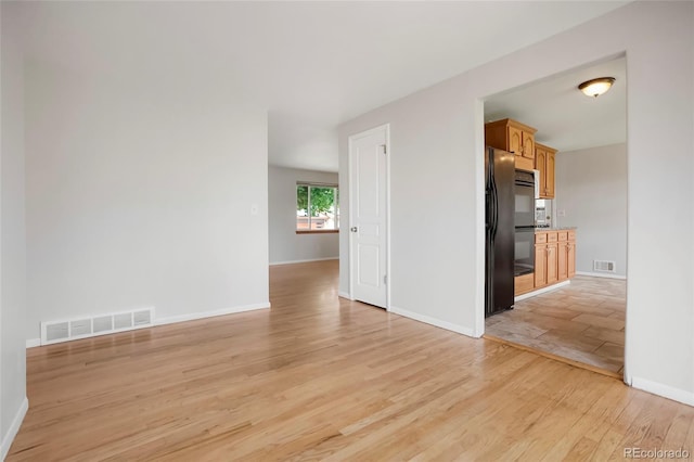 6698 S Wellington Ct, Centennial, CO 80121 - unfurnished living room featuring light wood finished floors and baseboards