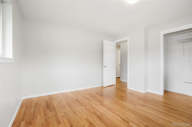 6698 S Wellington Ct, Centennial, CO 80121 - unfurnished bedroom featuring light wood-style flooring, baseboards, and a closet