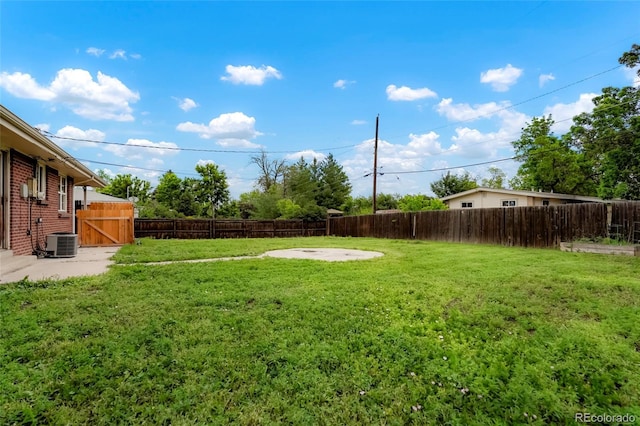 6698 S Wellington Ct, Centennial, CO 80121 - view of yard with central air condition unit, a gate, and a patio area
